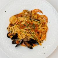 Linguine Mare · Thin flat long pasta with scallops, shrimp, Manila clams, mussels, garlic and fresh tomatoes...