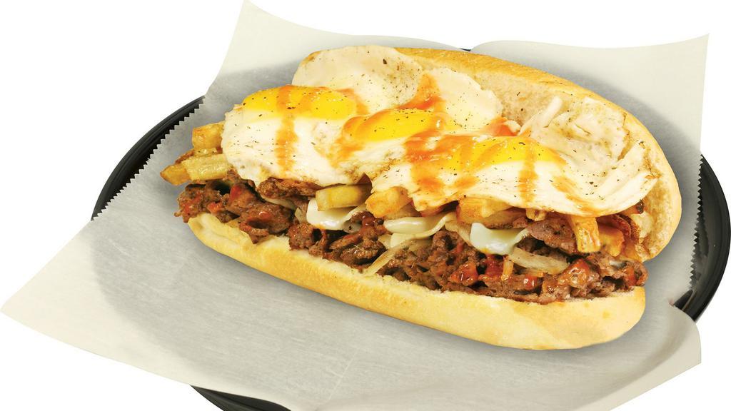 The Hangover · Grilled sirloin, onions, hot sauce, and Cheddar. Topped with fried eggs over easy and fries.