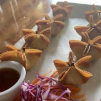 Crab Rangoon · crab, cream cheese green onions wrapped in wonton skins, golden deep fried