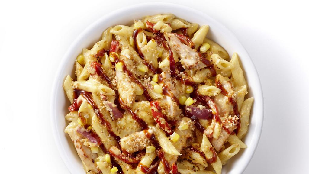 Bbq Chicken Mac & Cheese (Regular) · Alfredo Sauce, Cheddar Cheese, Parmesan, Chicken, Red  Onions, Corn and Red Peppers. Baked with a Panko crust and BBQ Sauce drizzled on top