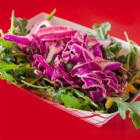 Salad · Arugula, purple cabbage, pickled onions, and house red pepper vinaigrette.