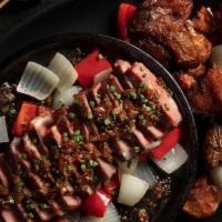Korean Bulgogi Steak · Savory bulgogi glaze, New York strip, crisped potatoes, onion.