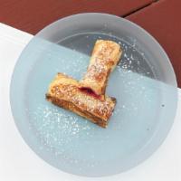 French Toast Roll-Ups · A slice of buttermilk bread filled with one of the delicious options below rolled up then di...