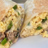 Morning Bird Wrap · White gravy, turkey sausage, Swiss cheese, scallions and scrambled eggs wrapped up in a toas...