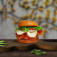 Love Is Chicken, Love Is Parm Sandwich  · Crispy fried chicken chicken topped with mozzarella cheese and fresh house marinara sauce. S...