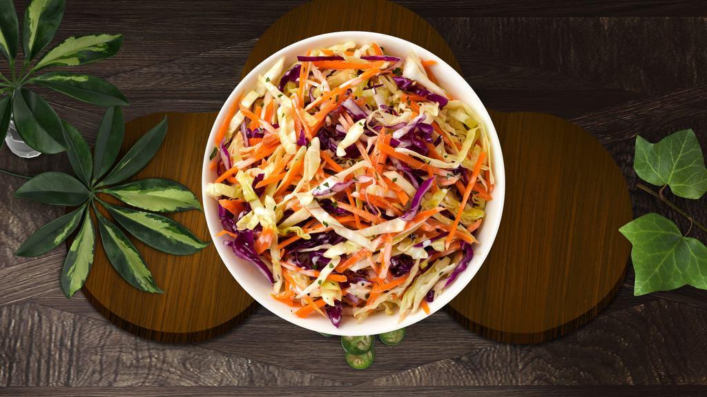 Callin' For Coleslaw · Shredded cabbage and carrots dressed in mayonnaise and apple cider vinegar.
