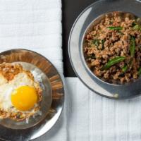 Kraprow Kai Dow       · Minced chicken or pork stir-fried with hot basil garlic chili. Served with a sunny side up e...