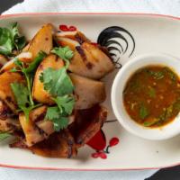 Thai Street Grilled Squid        · Grilled whole squid served with green chili-lime sauce.