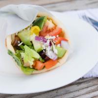 Veggie Gyro · Soft and warm pita bread, misted in olive oil, wrapped around fresh romaine lettuce, cucumbe...
