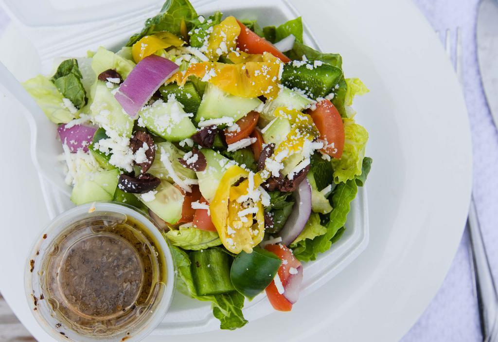 Small Greek Salad · Fresh romaine lettuce, chopped green bell pepper, cucumber, tomato, red onion, kalamata olives, pepperoncini, and crumbled feta cheese, served with house vinaigrette dressing without pita bread.