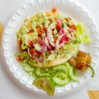 Fish Taco · Corn tortilla, battered tilapia topped with lettuce, pico, pickled onions and cilantro sauce.