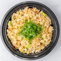Seasonal Vegan Cauliflower Fried Rice · Cauliflower, edamame, carrots, onions, celery, and seasonal vegetables.
