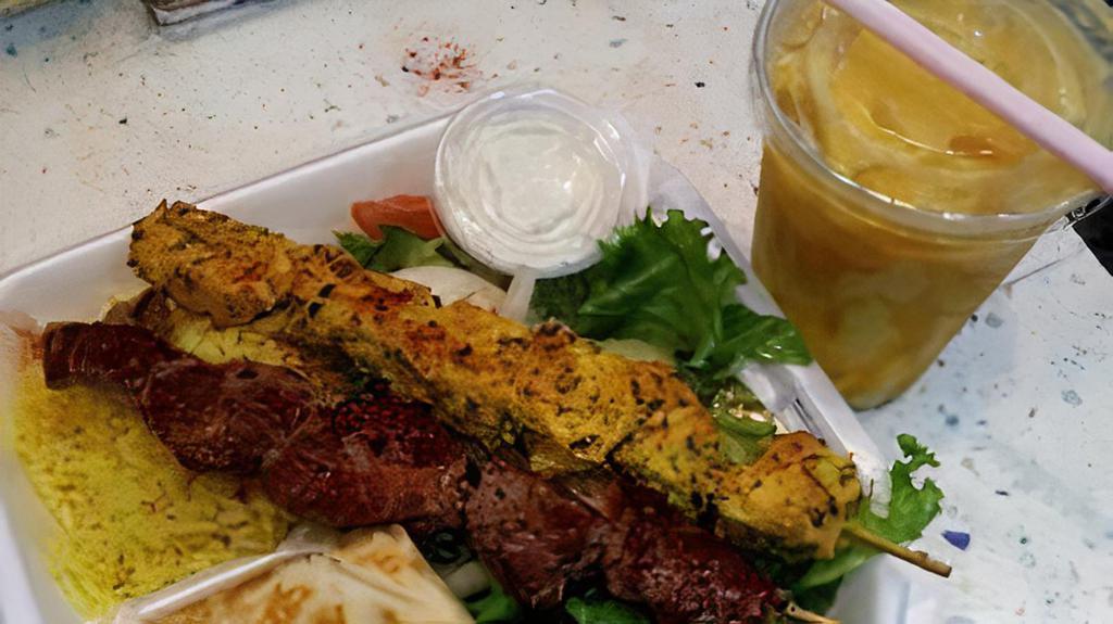Beef And Chicken Kabob · 2 skewers, chicken and beef kabob, rice, salad.
