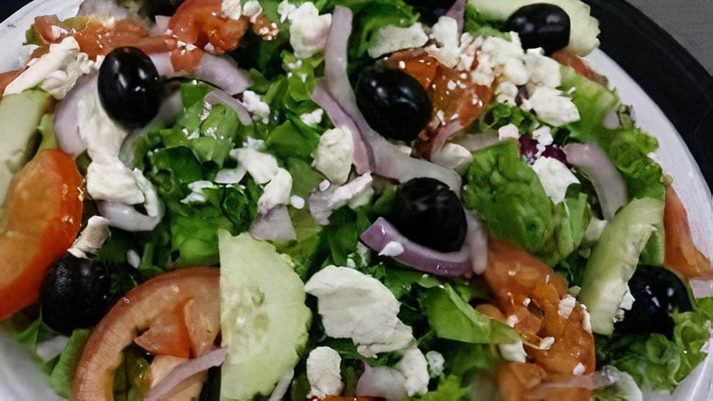 Greek Salad · Green lettuce, tomato, red onion, black olives, feta cheese vinaigrette dressing. Add meat lamb or chicken kabob for an additional charge.