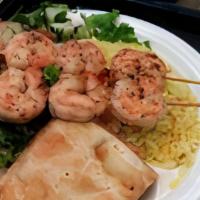 Shrimp Kabob · 2 shrimp kabob, salad, rice and pita bread.