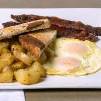 All American · Your choice of bacon, ham or sausage, two eggs cooked any style, served with potatoes and yo...