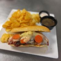French Dip · Tender Roast Beef stewed in au jus on a toasty baguette with melted gruyère and spicy giardi...