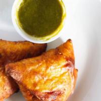 Veg Samosa  · Deep-fried pastry stuffed with lightly spiced potatoes and peas.