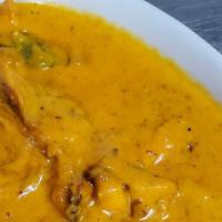 Butter Chicken · Gluten-free. Boneless pieces of chicken cooked in rich tomato sauce and topped with cream an...