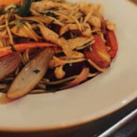 Tallarin Saltado · Peruvian lo mein, stir-fried noodles, sautéed red onions, ginger, tomatoes and green onions.