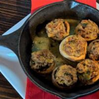 Spicy Italian Stuffed Mushrooms · Mushrooms stuffed with spicy Italian sausage, mixed cheeses, spinach, and baked golden brown.
