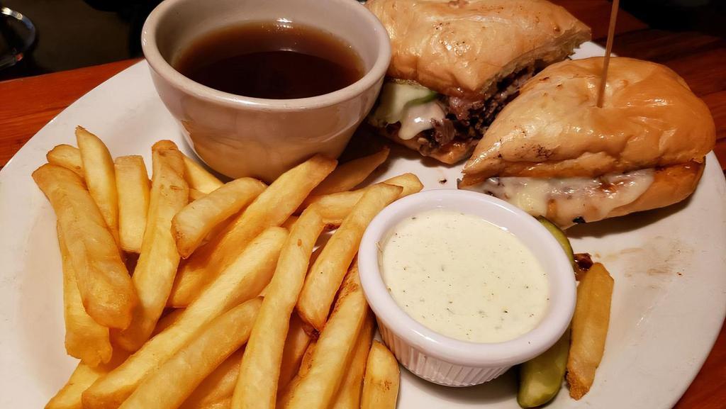 Bounty Hunter Dip · Homemade pot roast layered on a grilled French roll then covered with Swiss cheese and served with au jus for dipping. Ask for it loaded with mushrooms, bell peppers, and grilled onions.