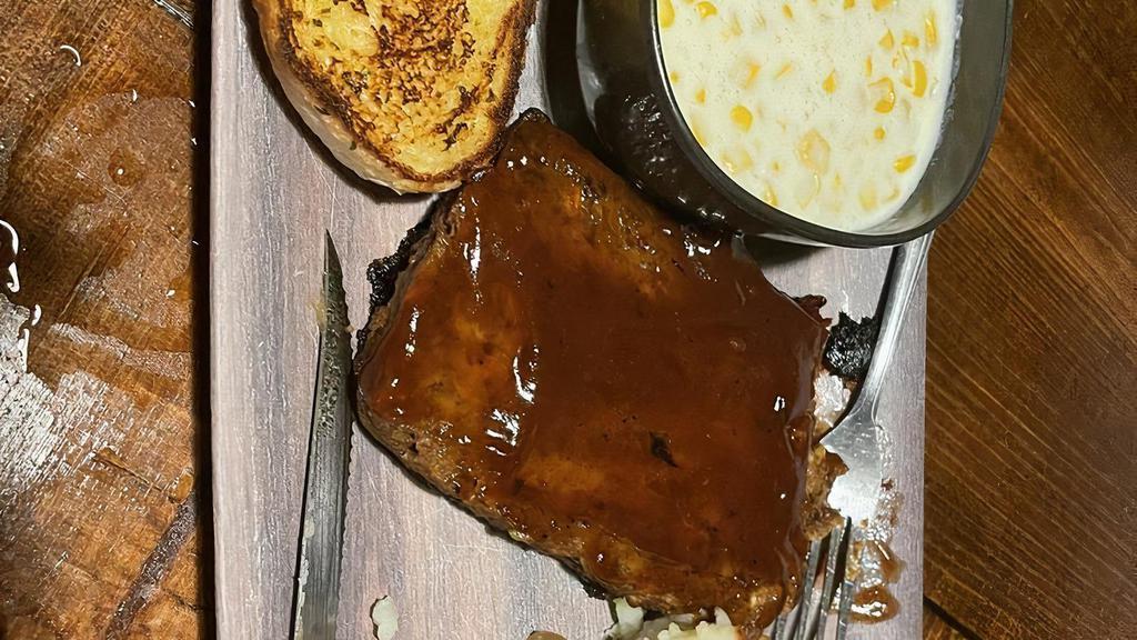 Bbq Glazed Meatloaf  Dinner · Our homemade meatloaf glazed with a sweet and spicy BBQ sauce. Served with mashed potatoes, creamed corn, and garlic bread.