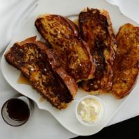 French Toast Combo · Two pieces of homemade toast, including two eggs and ham, bacon or sausage.