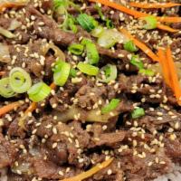 Beef Bulgogi Over Rice · BBQ beef over rice, carrot, onion, green onion, garlic powder, sesame seed, sesame seed oil....