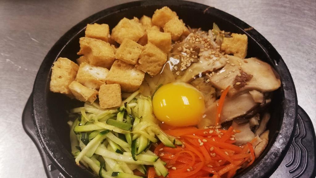 Tofu Bibimbop Vegetarian · Fried tofu, carrots, zucchini, mushroom, beansprout. Comes with steamed rice and side dishes