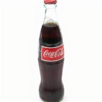 Mexican Coke · Imported from Mexico, made with real cane sugar, in an old school glass bottle 355ml, only a...