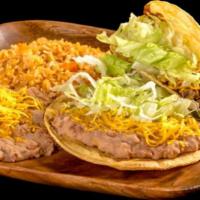 Tostada And Taco · Bean tostada with lettuce and cheese with a shredded beef taco with lettuce and cheese. Serv...