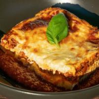 Lasagna Bolognese · Beef & pork blended with tomato, carrots, onions, celery layered with ricotta and pasta.