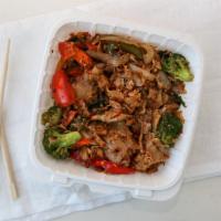 Phad Kee Mao (Drunken Noodles) · Stir-fried wide noodles with egg, broccoli, bell peppers, onions, tomatoes, carrots, basil l...