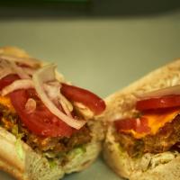 Veggie Burger · Vegetarian. Cheddar, Tomatoes, Onion, Lettuce & Mayo.