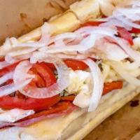 Italian · Hard Salami, Pepperoni, & Capicola. Provolone, Tomatoes, Onions, Lettuce, Mayo, & Sub Dressi...