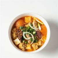 Bún Riêu · Vermicelli stick noodles in light tomato meat broth with soft chunks of crab-meat balls & to...