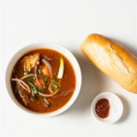 Bò Kho · Beef stew with potatoes & carrots. Choice of rice noodles (bánh phð), egg noodles (mi) or fr...