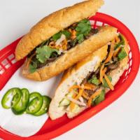 Bánh Mì / Sandwiches · Choice of protein paired with jalapeño, cucumber, cilantro, mayonnaise, pickled carrots & da...