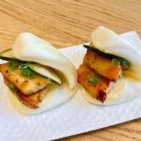 Pork Buns · Steamed bun with oven roasted confit pork belly, pickled cucumber, scallions, japanese mayo ...