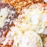 Chilaquiles Breakfast · Served with rice and beans. Tortillas not included add egg for $1.10