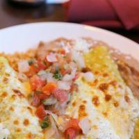 Chicken Enchiladas (Online) · Corn tortillas, filled with shredded chicken, smothered in green enchilada sauce, topped wit...