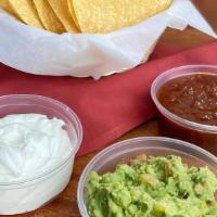 Chips And Salsa Trio · Chips served with a 16oz Guacamole, 8oz sour cream, and an 8oz salsa of your choice.<br /><b...