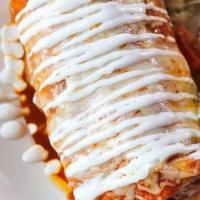 Beef Burrito (Online) · Shredded beef, refried beans, red rice, and cheese wrapped in a large flour tortilla. Topped...