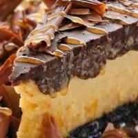 Mocha Cheesecake (Online) · Coffee infused cheesecake, oreo crumble crust, topped with a chocolate ganache, chocolate sa...
