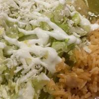 Enchiladas Verdes O Rojas · Three red or green chicken enchiladas topped with lettuce, cheese and sour cream.