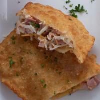 Pastel · Deep fried puff pastry, filled w/; cheese, ground beef, chicken with spreadable cheese, ham ...