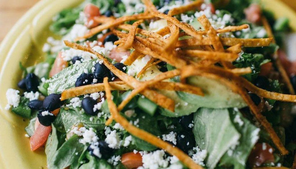 Ensalada Suprema · Romaine lettuce, black beans, crispy tortilla strips, bell peppers, tomato, avocado, and queso fresco. Your choice of ranch dressing, Chipotle dressing, or vinaigrette add any meat for an additional charge.