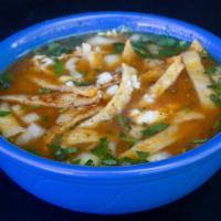 Chicken Tortilla Soup · Our house chicken broth with shredded chicken, diced onion, and cilantro topped with tortill...