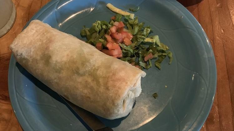 Burrito-Al Pastor · Smokey grilled pork with pineapple,  guacamole, and salsa fresca wrapped in a flour tortilla;
make as a bowl which includes rice and beans for $2;
add enchilada sauce and/or melted cheese on top for $1 each;
add rice and/or beans for $1 each inside your burrito.